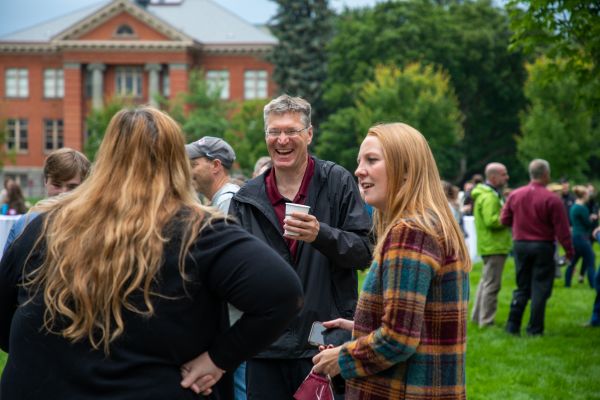 UM employees socializing and laughing