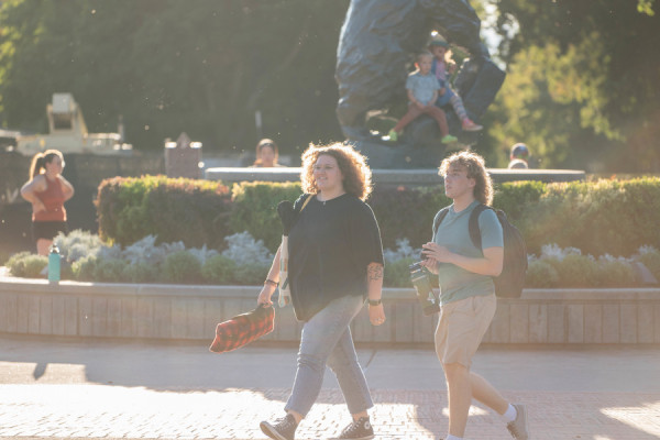 Students walking and talking on campus 