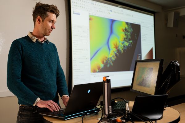 brinkerhoff stands in front of ORC display