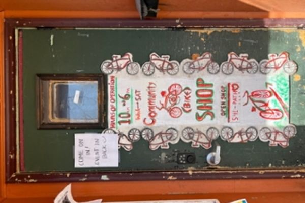 A picture of a door, with a sign that says "come on in"