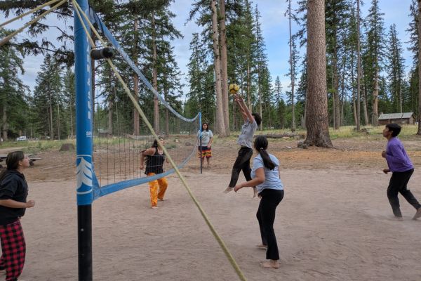 Photo of students playing volleyball at Camp Paxson.