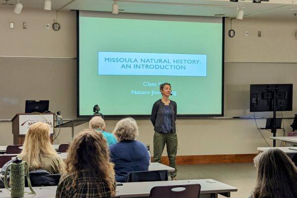 teaching in front of class