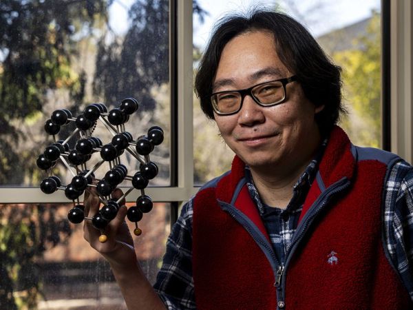 UM chemist Dong Wang poses with a molecule model