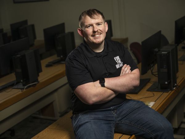 Jace Reddick sits in a classroom