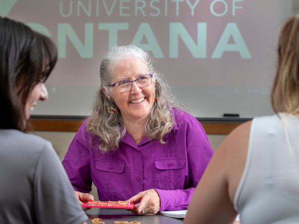 Faculty member smiling at students