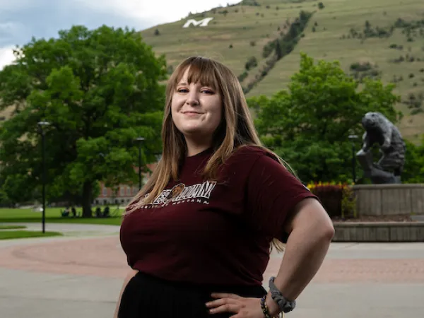 Daylee smiles for a portrait wearing University of Montana apparel