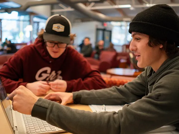 Two students study together 