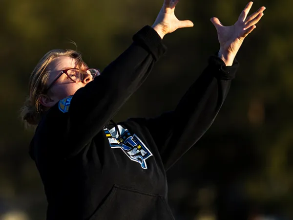 A flag football player catches a pass