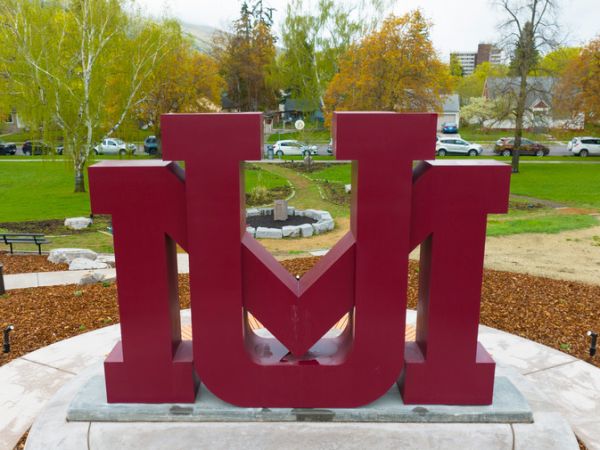 Maroon interlocking U and M sculpture