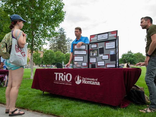 A student talks to the TRiO table at the annual BEAR Fair