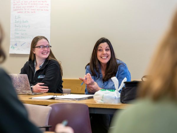 Creative writing student engaging in classroom discussion