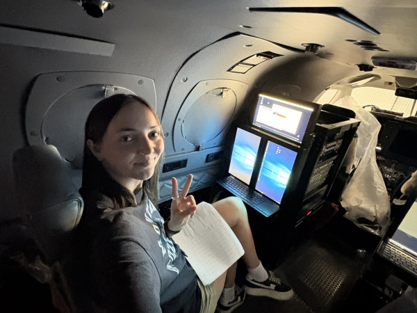 UM student in an airplane collecting air pollution data.