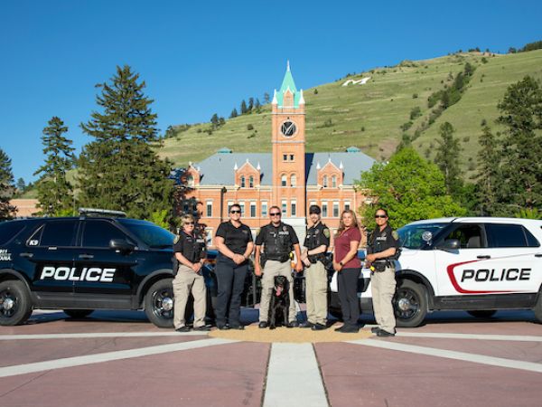 police posing by their cars