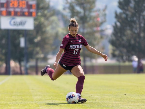 soccer player dribbling ball