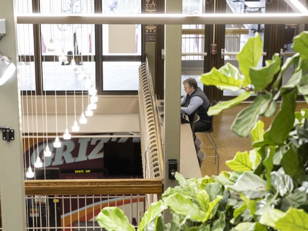 man sitting in UC showing plants and LED lights