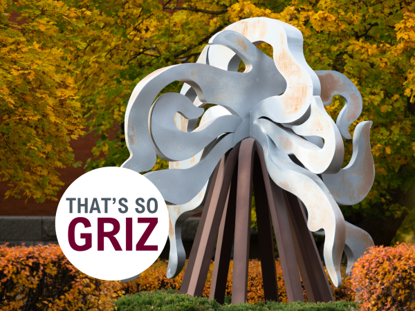 image of an art sculpture surrounded by fall foliage