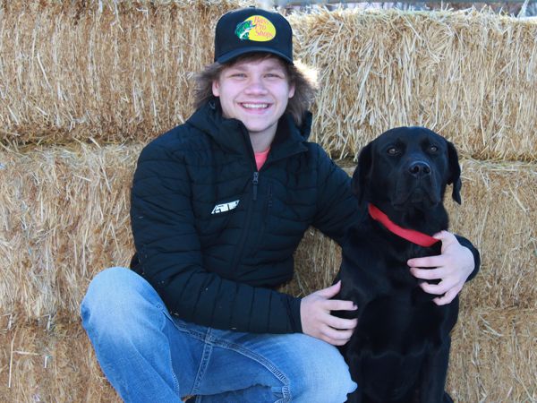 Conrad High School senior Brady Barnhill, pictured with his dog Diesel.