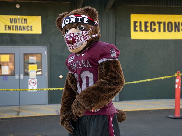 Monte the mascot stands outside a Missoula polling place.