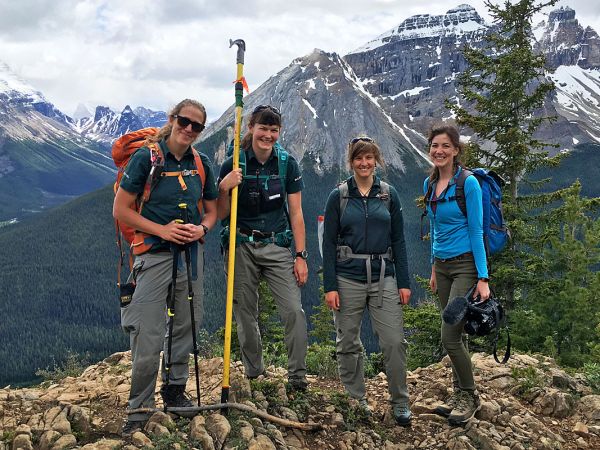 “Ghost Forests” producer Breanna McCabe (far right) stops to smile alongside Parks Canada whitebark pine specialists Laura Kroesen, Megan Kinley and Roslyn Johnson on Paget Peak.