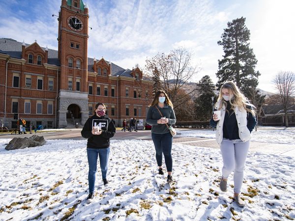 Photo of students walking across campus