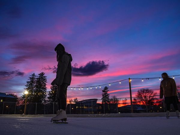 UM students skate at sunset on the Oval.