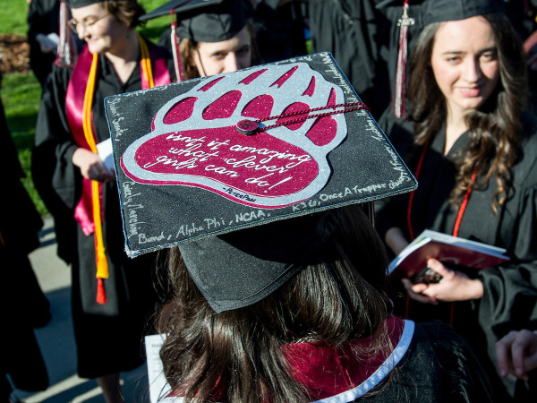 Photo of a mortar board with Griz paw on it.