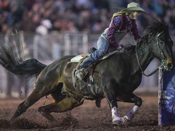 A photo of Ashtyn Carlson competing in barrel racing. 
