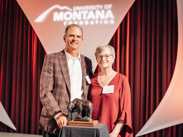 A picture of Mark and Cheryl Burnham with the Order of the Grizzly Award. 