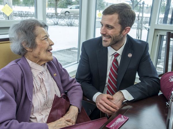 A picture of Emma Lommasson meeting UM President Seth Bodnar.