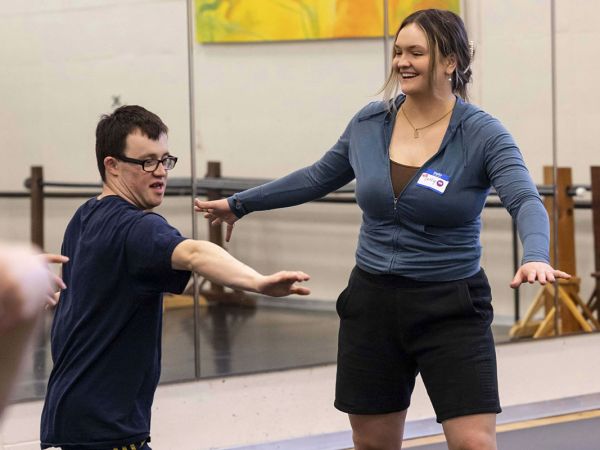 Seely Garrett (right) works with participant Liam Mulcaire-Jones in New Visions Dance class. 