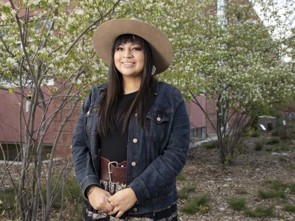 Courtney Little Axe posses for photo by Payne Center