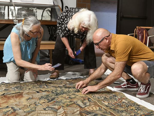 Photo of Missoula Guild members looking at Tapestry