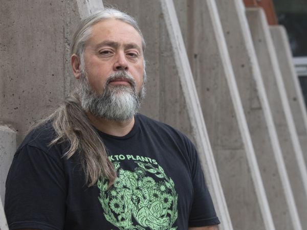 A headshot photo of poet Chris La Tray. 