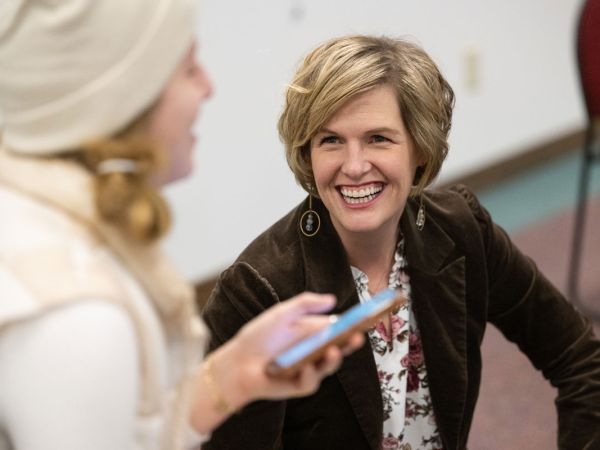 Heather Voorhees, a UM communication studies assistant professor, visits with a student in her new Health Misinformation class. 