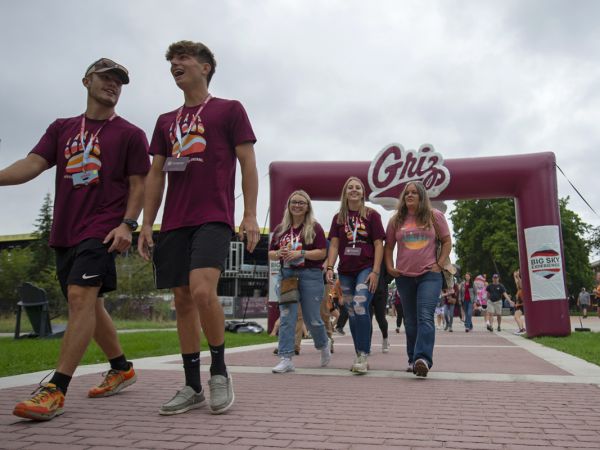 An image of UM students walking outside during the Big Sky Experience.