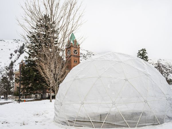 A snow dome before Main Hall on the University of Montana Oval