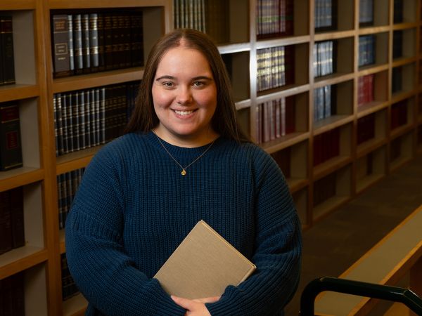 Student Jayden Beed stands for a photo in UM’s Jameson Law Library