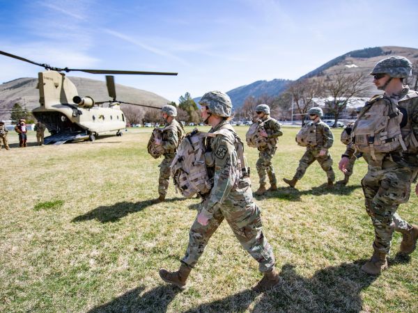 UM ROTC students load a Chinook Helicopter on campus