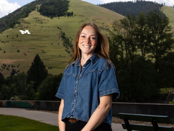 An image of Kirsten Gehl in Missoula with Sentinel in the distance behind her. 