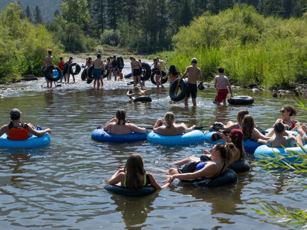 An image of UM students floating in tubes on the Clark Fork River. 