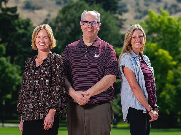 The three new deans pose for a photo.
