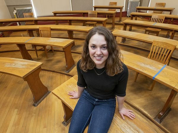 UM student Betta Lyon-Delsordo sits in a classroom at the University of Montana