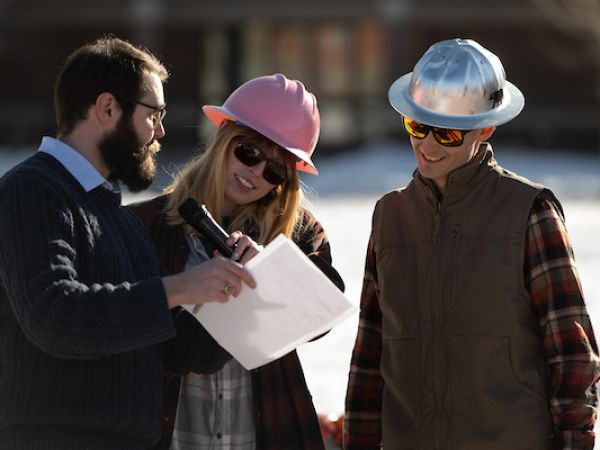students at Boondocker's day on the oval. One is wearing a hard hat.