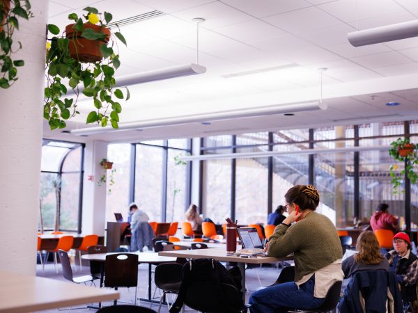 Large room with people studying 