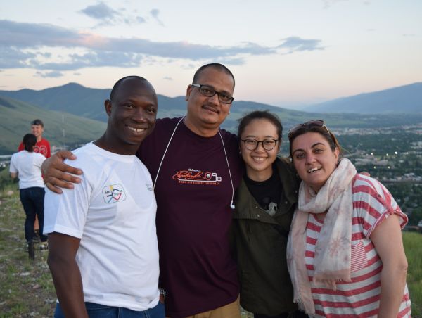 Four people at the top of hill