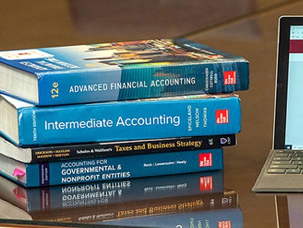 Accounting books stacked.