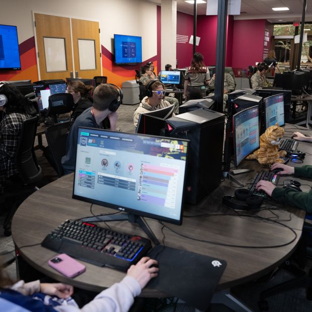 eSports students sit at computers during a competition