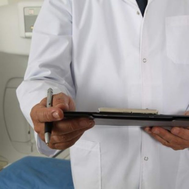 Medical staff holding a clipboard