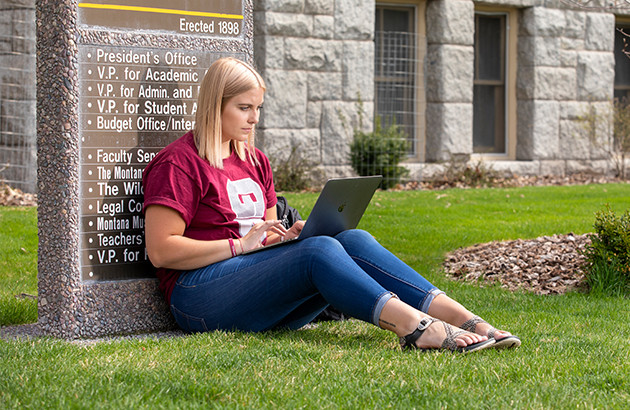 student studying on laptop
