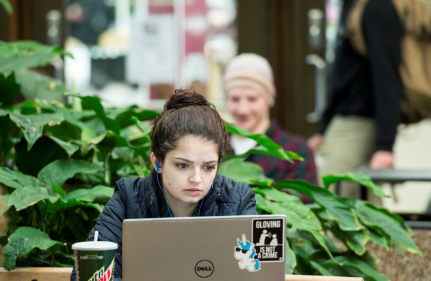 A student works on a laptop computer